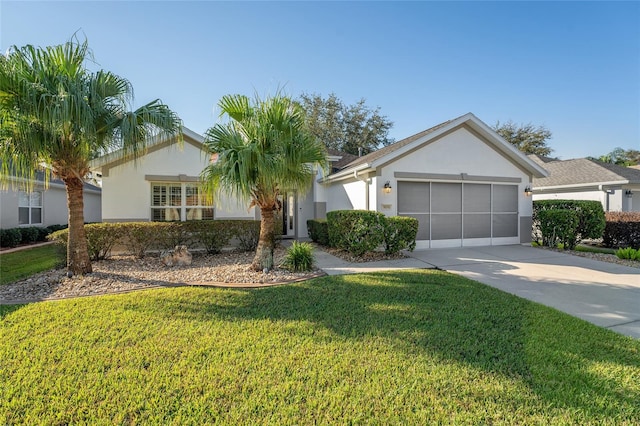 ranch-style house featuring a front yard and a garage