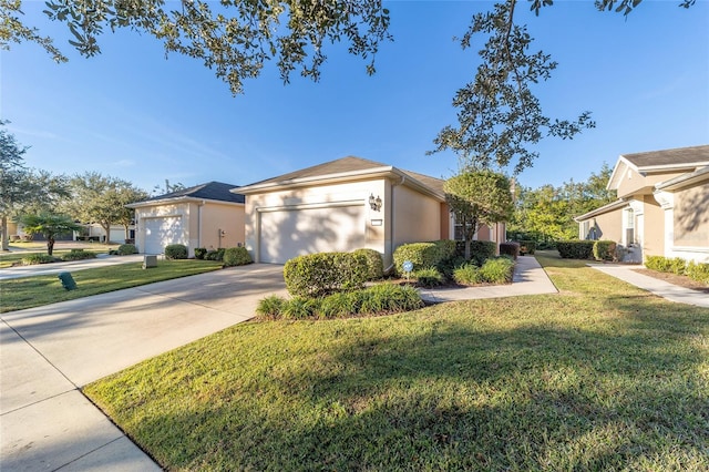 view of front of property with a garage and a front lawn