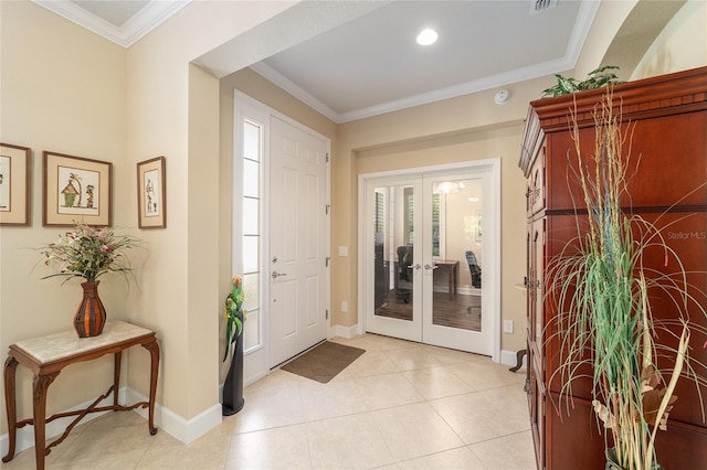 entryway featuring french doors, ornamental molding, light tile patterned floors, and a wealth of natural light