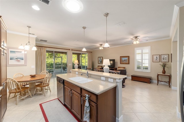 kitchen featuring sink, a wealth of natural light, stainless steel dishwasher, and an island with sink