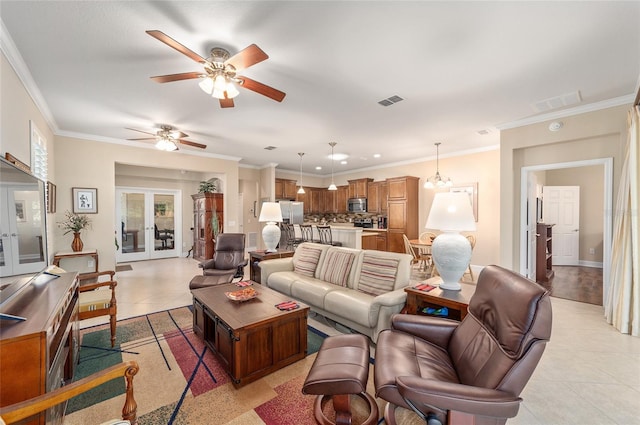 living room with french doors, ceiling fan, ornamental molding, and light tile patterned floors