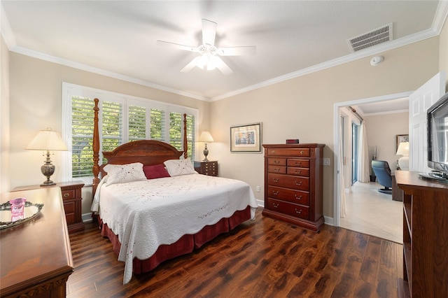 bedroom with ceiling fan, ornamental molding, and dark hardwood / wood-style floors