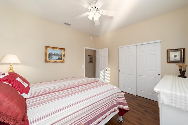 bedroom featuring a closet, ceiling fan, and dark hardwood / wood-style flooring