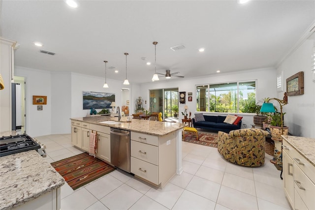 kitchen featuring light stone countertops, sink, hanging light fixtures, stainless steel dishwasher, and a kitchen island with sink