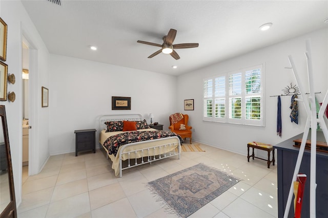 tiled bedroom featuring ceiling fan