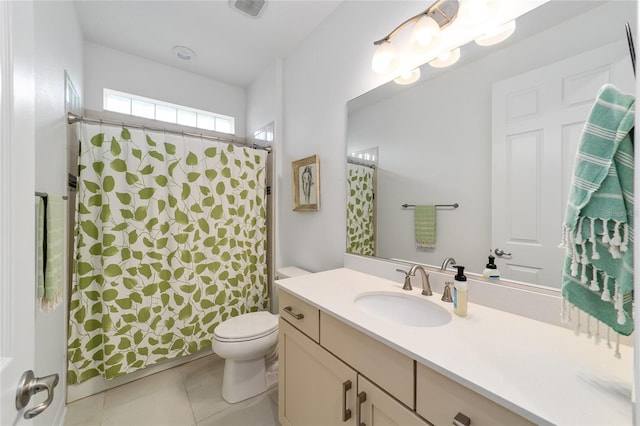 bathroom with vanity, a shower with curtain, toilet, and tile patterned floors