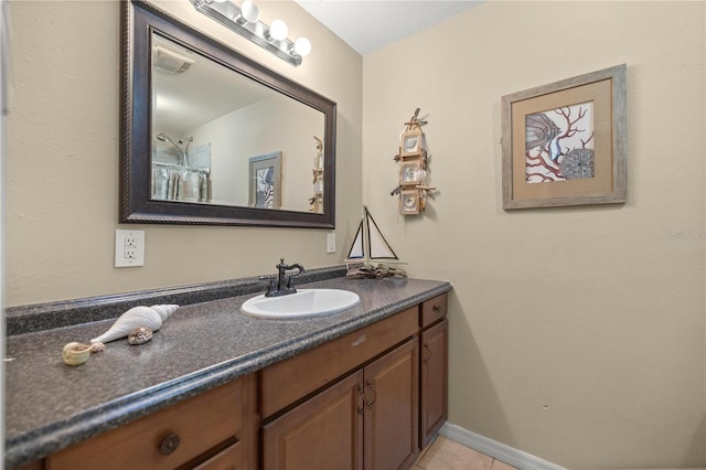 bathroom with vanity and tile patterned floors