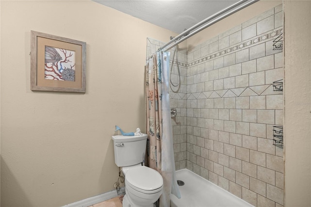 bathroom featuring a shower with curtain and toilet