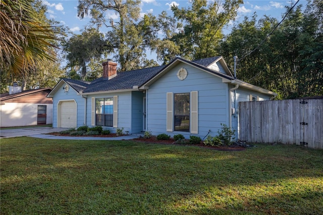 ranch-style home with a front lawn and a garage