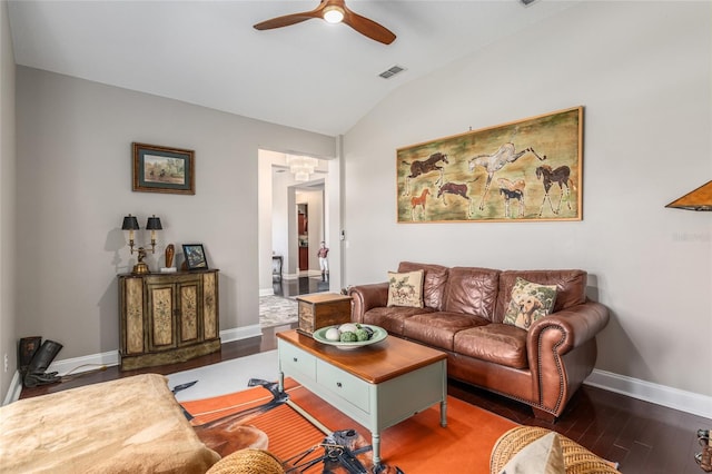 living room with ceiling fan, vaulted ceiling, and hardwood / wood-style floors