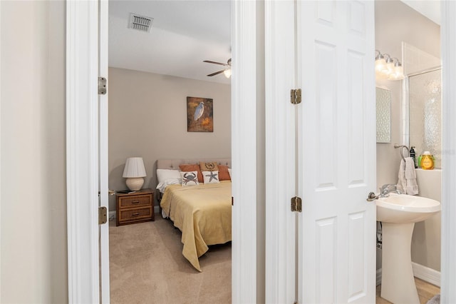 bedroom with light colored carpet and ceiling fan