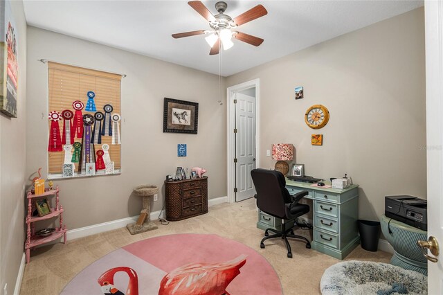 office space with ceiling fan and light colored carpet