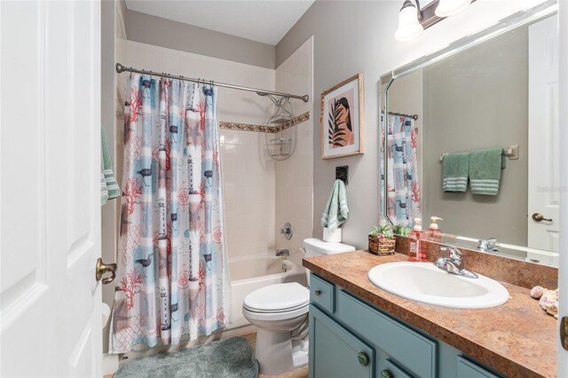 full bathroom with vanity, toilet, and shower / tub combo