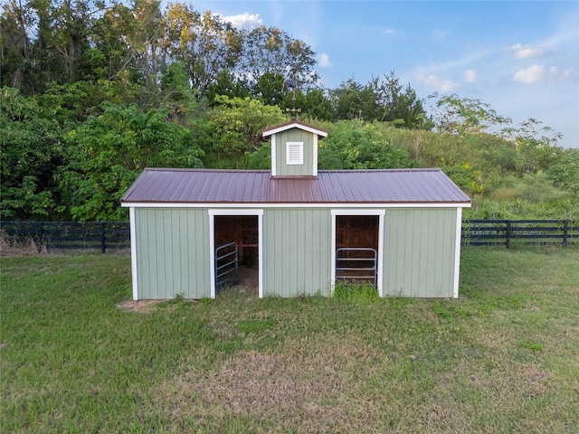 view of outdoor structure with a lawn