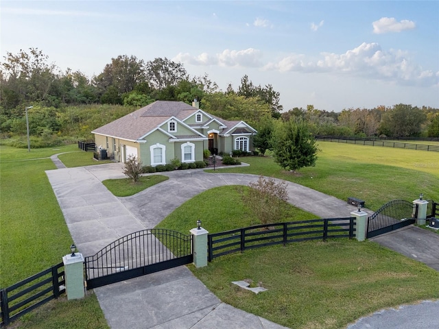 view of front of property featuring a front yard and a rural view