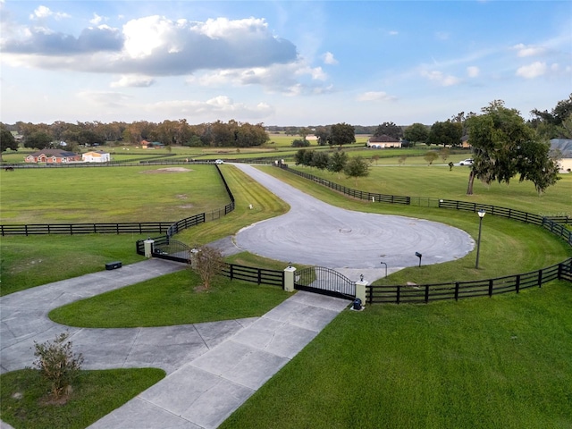 surrounding community with a yard and a rural view