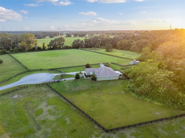 birds eye view of property with a rural view