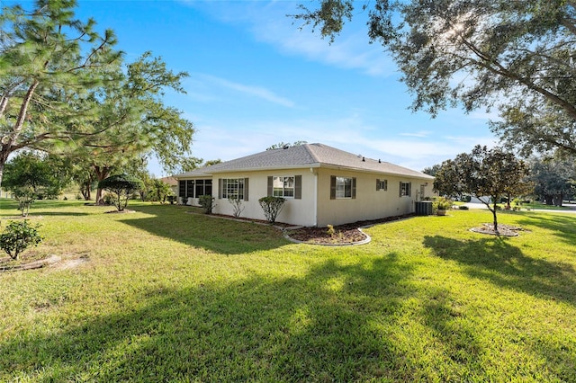 view of property exterior featuring cooling unit and a lawn