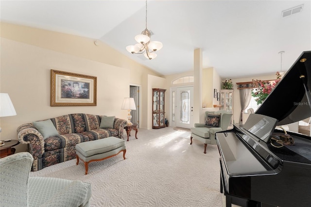 living room featuring lofted ceiling, a chandelier, and carpet floors