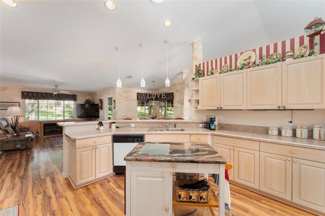 kitchen with sink, light wood-type flooring, white dishwasher, a center island, and ceiling fan