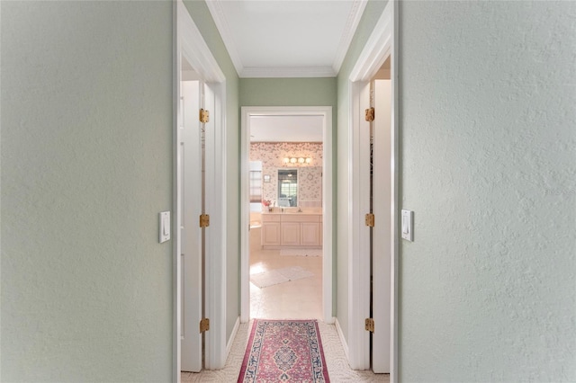 hallway featuring crown molding and light tile patterned floors