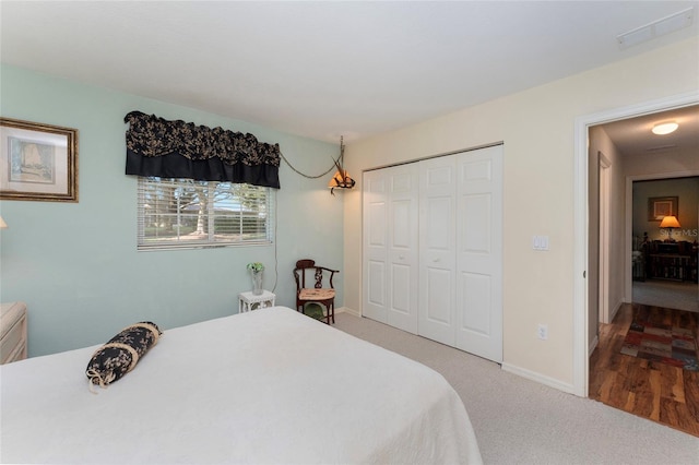 bedroom featuring a closet and carpet flooring