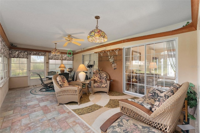 sunroom with ceiling fan