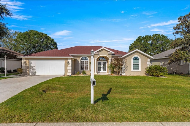 ranch-style home featuring a front lawn and a garage