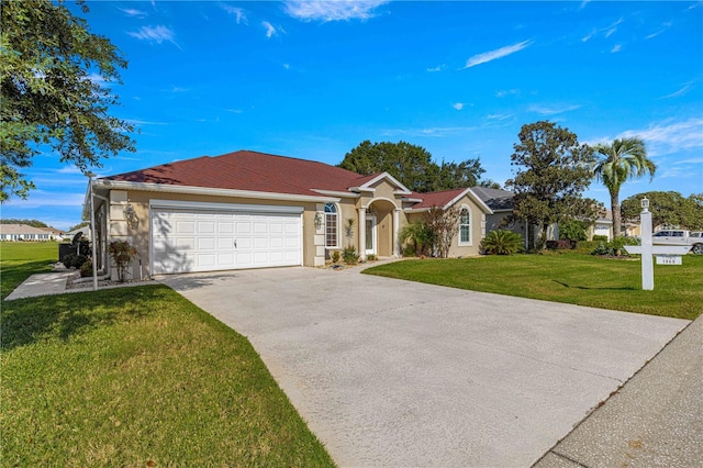 ranch-style house featuring a garage and a front lawn