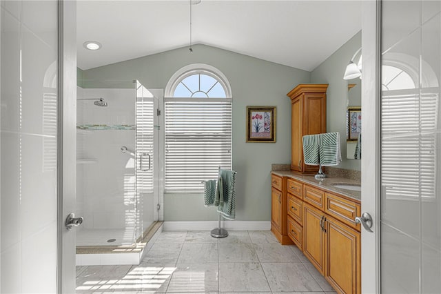 bathroom with vanity, an enclosed shower, tile patterned floors, and vaulted ceiling