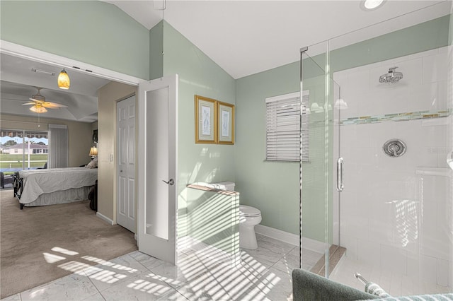 bathroom with toilet, lofted ceiling, a shower with shower door, and ceiling fan