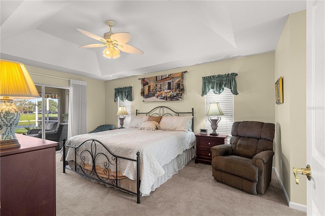 1960 NW 50th Cir, Ocala, FL 34482 - bedroom with light carpet, access to exterior, ceiling fan, a tray ceiling, and baseboards