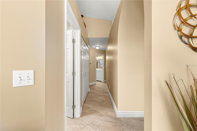 hallway featuring light tile patterned floors