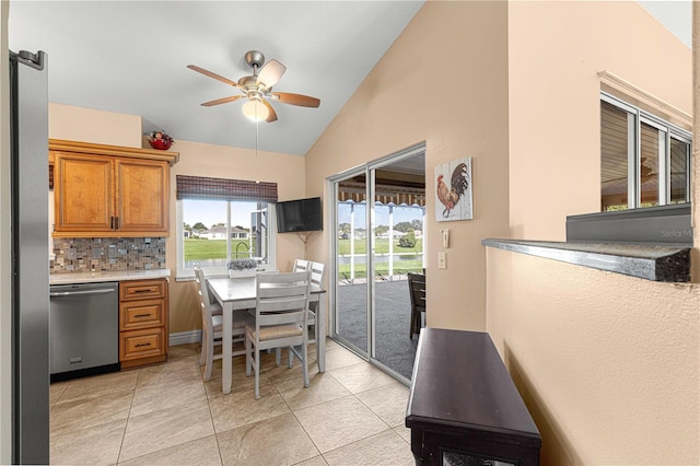 1960 NW 50th Cir, Ocala, FL 34482 - dining room with vaulted ceiling, ceiling fan, and light tile patterned floors