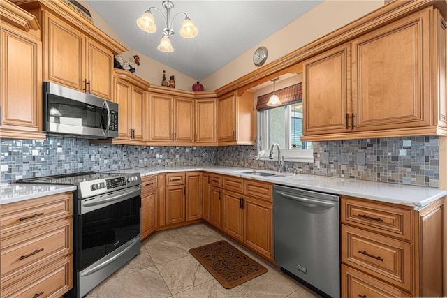 1960 NW 50th Cir, Ocala, FL 34482 - kitchen featuring stainless steel appliances, a sink, vaulted ceiling, light countertops, and backsplash