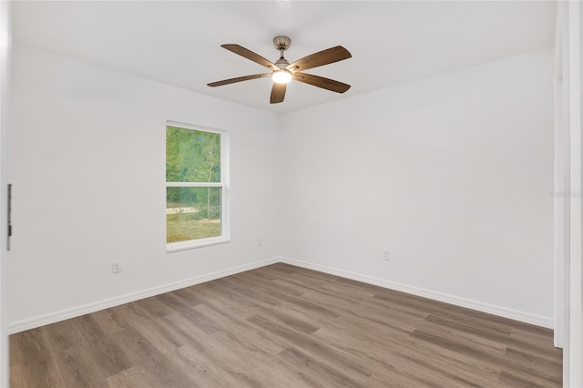 spare room featuring ceiling fan and hardwood / wood-style floors