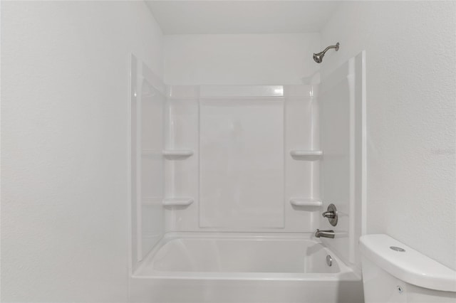 bathroom featuring toilet and tub / shower combination