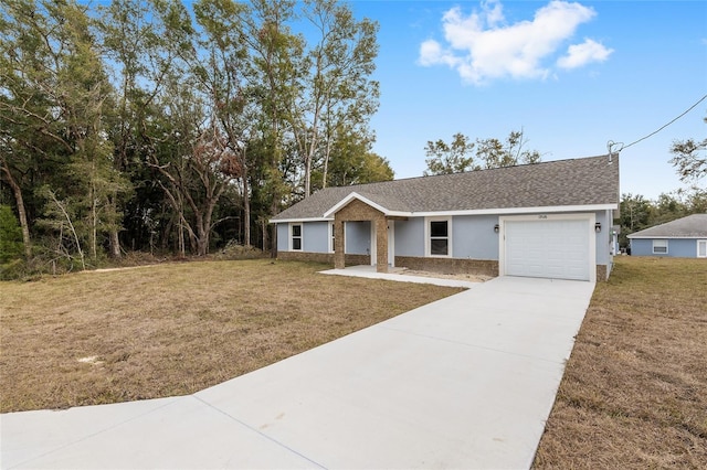 ranch-style house with a garage and a front yard