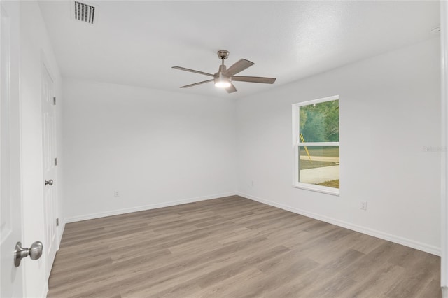 unfurnished room with ceiling fan and light hardwood / wood-style flooring