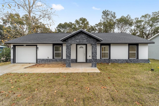 ranch-style home featuring a front yard and a garage