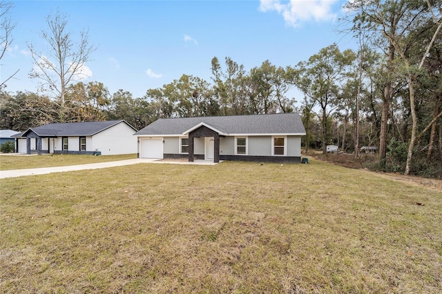 single story home with a garage and a front yard