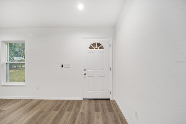 foyer entrance with light wood-type flooring