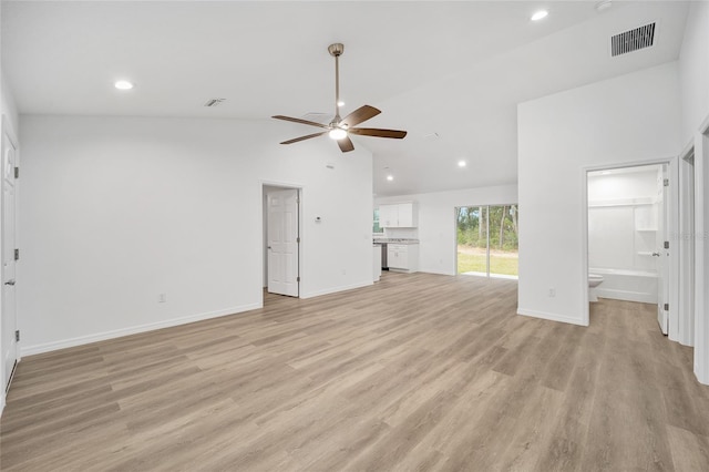 unfurnished living room with lofted ceiling, ceiling fan, and light wood-type flooring