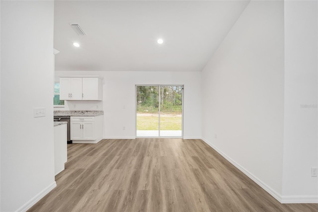 unfurnished living room featuring light hardwood / wood-style flooring