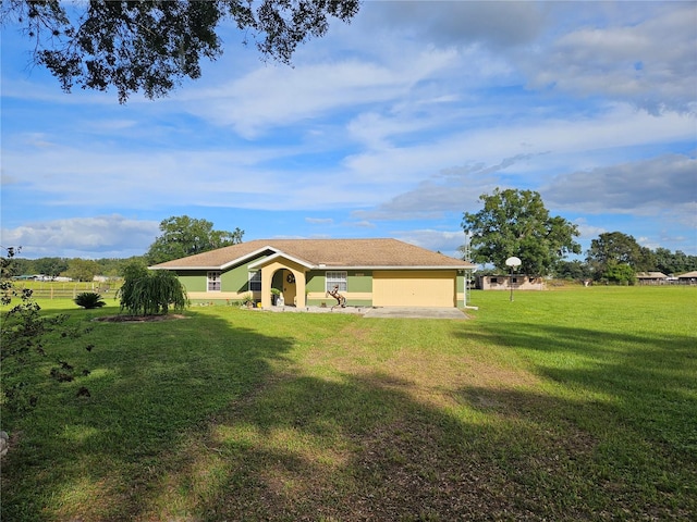 exterior space with a lawn and a garage