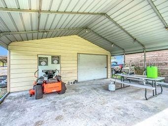 garage featuring a carport