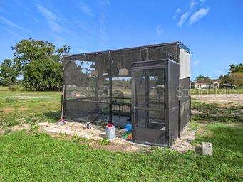 view of outbuilding featuring a yard