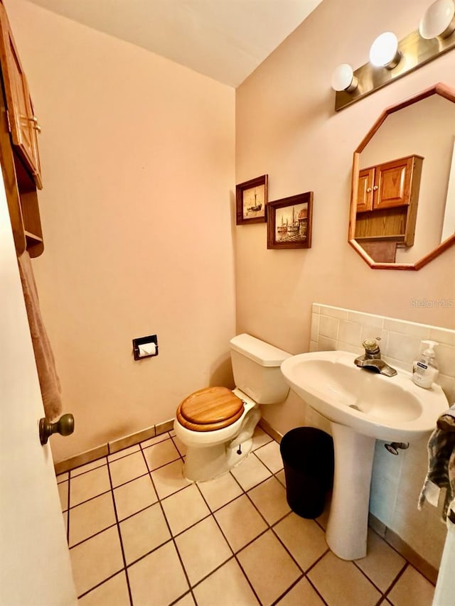 bathroom with tile patterned flooring and toilet