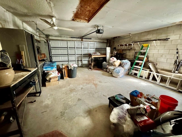 garage featuring a garage door opener and ceiling fan