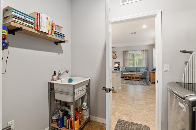 clothes washing area with independent washer and dryer